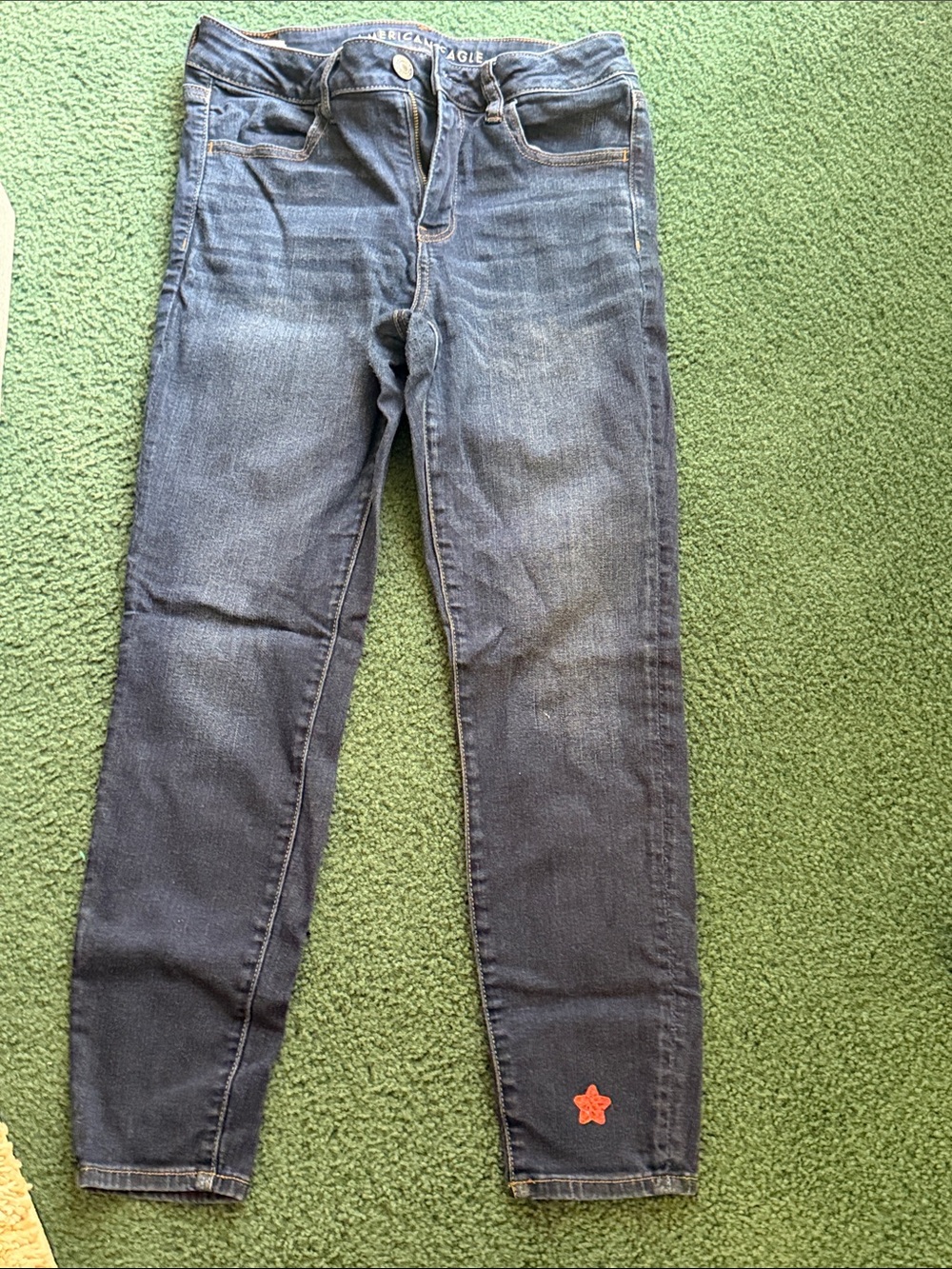 American Eagle Outfitters Dark Blue Skinny Jeans with Orange Star Accent